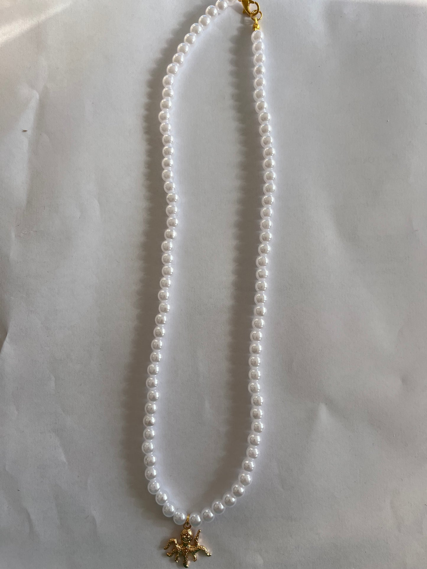 Pearl necklace with an octopus charm