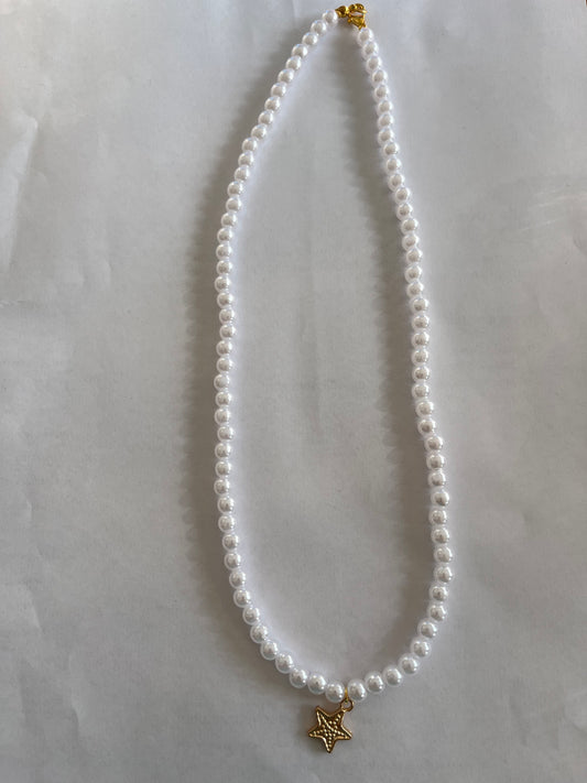 Pearl necklace with a star charm
