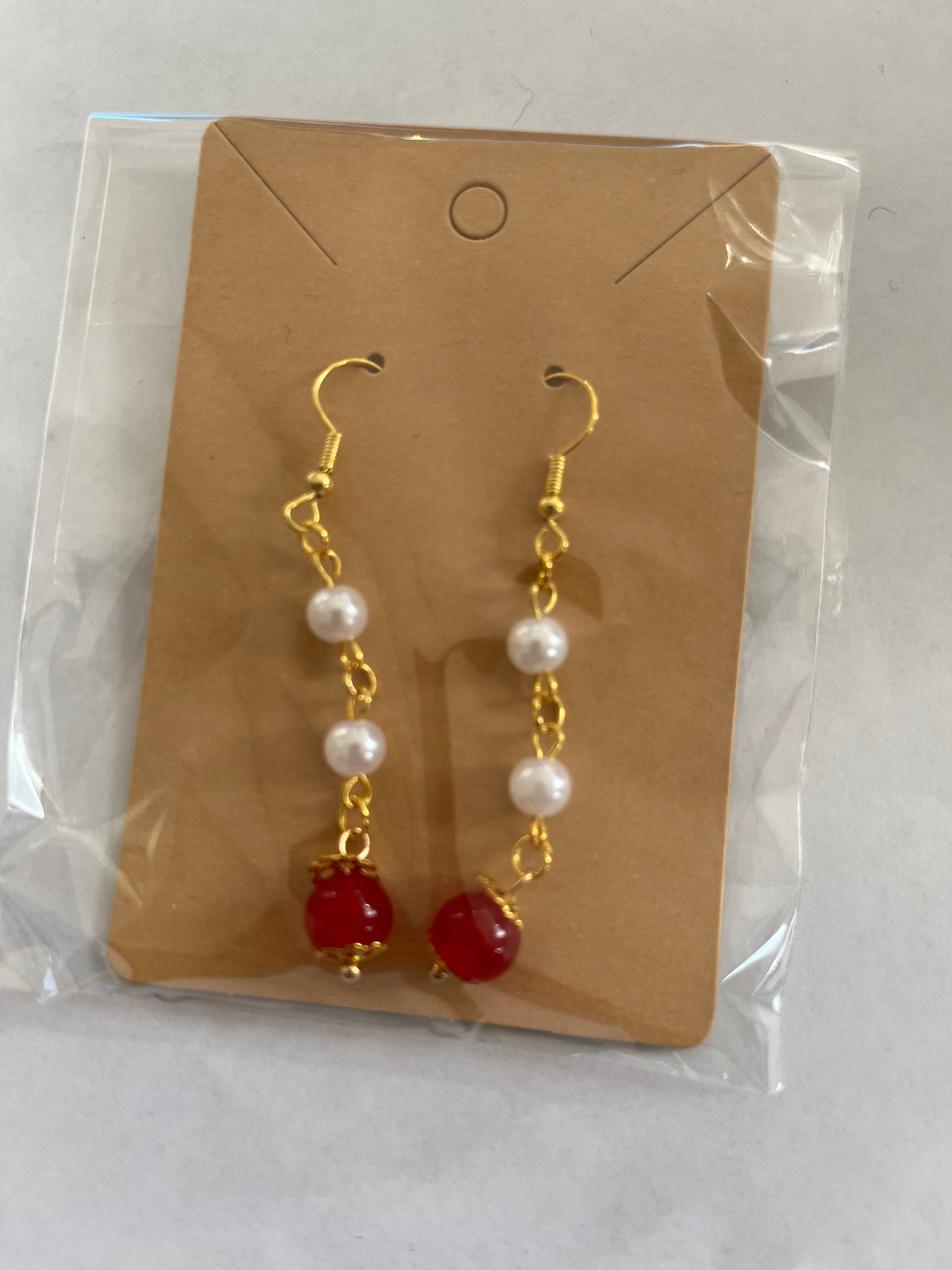 the cherry crown with golden tone earrings